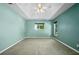 Spacious main bedroom with carpet, ceiling fan, and lots of natural light at 5097 Nw 19Th Pl, Ocala, FL 34482