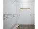 Bright walk-in closet with wire shelving and wooden hooks on the back wall for maximum storage capacity at 5097 Nw 19Th Pl, Ocala, FL 34482