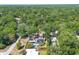 Beautiful aerial shot of the property, revealing its private setting, pool and lush surroundings at 510 E Wisconsin Ave, Orange City, FL 32763