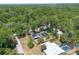 Beautiful aerial shot of the property, revealing its private setting, pool and lush surroundings at 510 E Wisconsin Ave, Orange City, FL 32763