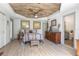 Comfortable bedroom featuring a statement wood plank ceiling and wood-look tile floors at 510 E Wisconsin Ave, Orange City, FL 32763