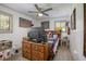 Comfortable bedroom featuring rustic decor, ceiling fan and wood-look flooring at 510 E Wisconsin Ave, Orange City, FL 32763