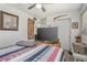 Cozy bedroom featuring a ceiling fan, and a TV console for storage at 510 E Wisconsin Ave, Orange City, FL 32763