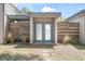 Inviting front entrance with frosted double doors and unique wooden accent fencing at 510 E Wisconsin Ave, Orange City, FL 32763