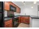 Kitchen with stainless steel faucet and black appliances at 510 E Wisconsin Ave, Orange City, FL 32763