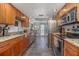 Cozy kitchen with granite countertops, stainless steel appliances, and tile flooring at 510 E Wisconsin Ave, Orange City, FL 32763