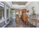 Kitchen area with breakfast table, stainless steel appliances, tile floors, and views of the patio at 510 E Wisconsin Ave, Orange City, FL 32763