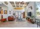 Bright living room with high ceilings, decorative surfboard, and comfortable seating at 510 E Wisconsin Ave, Orange City, FL 32763