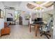 Open-concept living room featuring wood-look flooring, statement ceiling and abundant natural light at 510 E Wisconsin Ave, Orange City, FL 32763