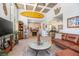 Open-concept living space with surfboard decor and fireplace, seamlessly connected to other areas at 510 E Wisconsin Ave, Orange City, FL 32763