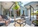 Covered patio area with comfortable seating, perfect for outdoor relaxation at 510 E Wisconsin Ave, Orange City, FL 32763
