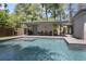 Inviting pool area with lounge furniture and lush landscaping at 510 E Wisconsin Ave, Orange City, FL 32763