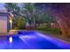 Backyard view featuring a sparkling in-ground pool and outdoor dining area with fence at 510 E Wisconsin Ave, Orange City, FL 32763