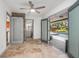 Beautiful sunroom with tile flooring, leading to pool area with outdoor seating at 510 E Wisconsin Ave, Orange City, FL 32763
