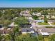 The property's aerial view reveals a beautiful neighborhood setting and showcases backyard with pool at 5400 Turton Ln, Port Orange, FL 32127