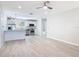 Open-concept floor plan integrating the bright living room with a modern eat-in kitchen at 5400 Turton Ln, Port Orange, FL 32127