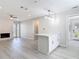 Bright living space featuring living room, eat-in kitchen, and ample natural light at 5400 Turton Ln, Port Orange, FL 32127