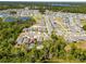 Aerial shot showing the property nestled in a community near a lake, surrounded by lush green spaces at 6006 Mount Zion Cir, Deland, FL 32724