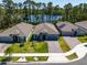 Beautiful aerial view of a single-story home next to a pond and surrounded by tall trees at 6006 Mount Zion Cir, Deland, FL 32724