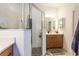 Modern bathroom features a glass enclosed shower with white subway tile and gray stone tile floor at 6006 Mount Zion Cir, Deland, FL 32724
