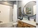 Updated bathroom with a shower-tub combo, floating single sink vanity, and tile flooring at 6006 Mount Zion Cir, Deland, FL 32724