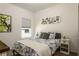 Bright bedroom with a floral patterned duvet cover and white bedside tables at 6006 Mount Zion Cir, Deland, FL 32724