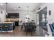 Bright dining area with a modern table setting, sliding glass doors, and stylish lighting at 6006 Mount Zion Cir, Deland, FL 32724