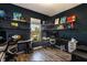Functional home office provides ample desk space, built-in shelves, and natural light from the window at 6006 Mount Zion Cir, Deland, FL 32724