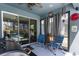 A screened-in patio with sliding glass doors, offering a relaxing outdoor space with comfortable seating at 6006 Mount Zion Cir, Deland, FL 32724