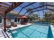 Relaxing screened-in pool area with seating, a pergola, and view of the backyard and neighboring houses at 6006 Mount Zion Cir, Deland, FL 32724