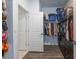 Open walk-in closet with well-organized shelving and hanging rods for ample storage space at 6006 Mount Zion Cir, Deland, FL 32724