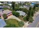 Aerial view of property showcasing its location, lush landscaping, and proximity to surrounding neighborhood features at 605 Goodall Ave, Daytona Beach, FL 32118