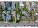 Aerial view showing the property's location within a neighborhood, close to the road and other residential homes at 605 Goodall Ave, Daytona Beach, FL 32118