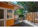 Backyard with deck, privacy fence, and tropical landscaping at 605 Goodall Ave, Daytona Beach, FL 32118