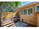 Exterior view of home with deck, stairs, and patio area at 605 Goodall Ave, Daytona Beach, FL 32118
