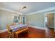 Spacious dining room featuring hardwood floors, a chandelier, and built-in cabinets, perfect for hosting gatherings at 605 Goodall Ave, Daytona Beach, FL 32118