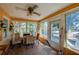Bright sunroom with tiled floors, multiple windows, and comfortable seating, perfect for enjoying natural light at 605 Goodall Ave, Daytona Beach, FL 32118