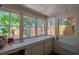 Bright sunroom featuring multiple windows overlooking the backyard at 605 Goodall Ave, Daytona Beach, FL 32118