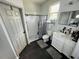 Clean bathroom with modern fixtures, a walk-in shower, and a white vanity with storage at 606 W Voorhis Ave, Deland, FL 32720