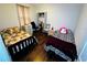 Bedroom featuring two beds, wood floors, and a closet at 606 W Voorhis Ave, Deland, FL 32720