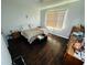 Cozy bedroom featuring hardwood floors, natural light, and ample closet space at 606 W Voorhis Ave, Deland, FL 32720