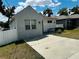 Charming home featuring a well-maintained front yard, private drive and a welcoming entryway at 606 W Voorhis Ave, Deland, FL 32720