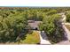 Bird's eye view of a home nestled among mature trees, showcasing its expansive and secluded property at 639 Elwood St, Deltona, FL 32725