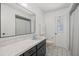 Bathroom featuring black and white tile, sink, and toilet at 639 Elwood St, Deltona, FL 32725