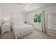Cozy bedroom features soft carpet, natural light, and neutral paint at 639 Elwood St, Deltona, FL 32725