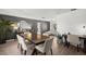 Open-concept dining area featuring a modern table setting, flowing seamlessly into the living space at 639 Elwood St, Deltona, FL 32725