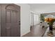 Inviting entryway displaying modern decor, which leads to the dining area and living space with wood flooring at 639 Elwood St, Deltona, FL 32725