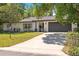 Charming one-story home with a manicured lawn and two-car garage, exuding curb appeal at 639 Elwood St, Deltona, FL 32725
