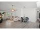 Bright living room features vaulted ceiling, hardwood floors, comfortable furniture, and recessed lighting at 639 Elwood St, Deltona, FL 32725