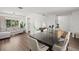Spacious living and dining area with wood flooring, neutral decor, and ample natural light at 639 Elwood St, Deltona, FL 32725